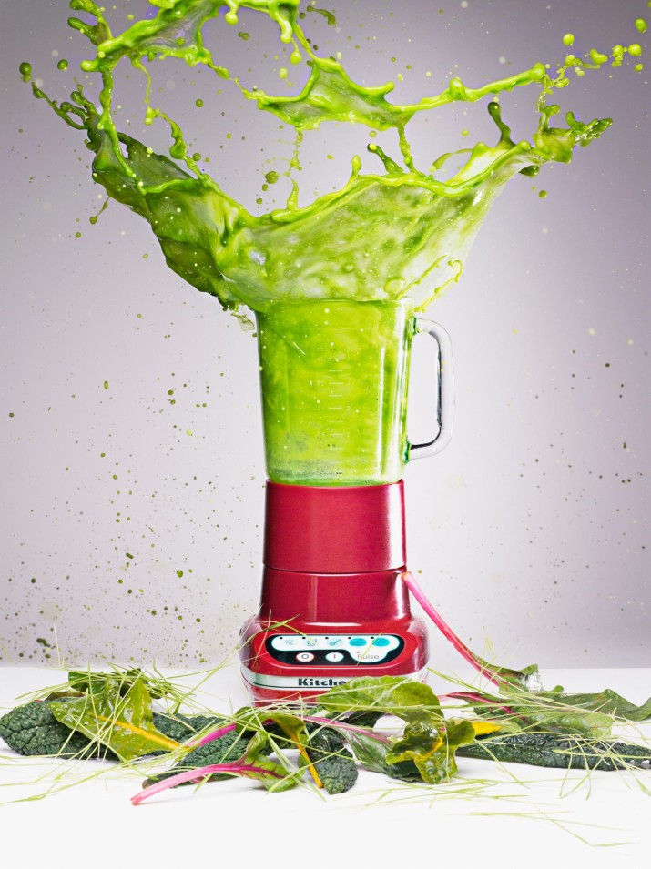 Vegetable juice splashing from blender